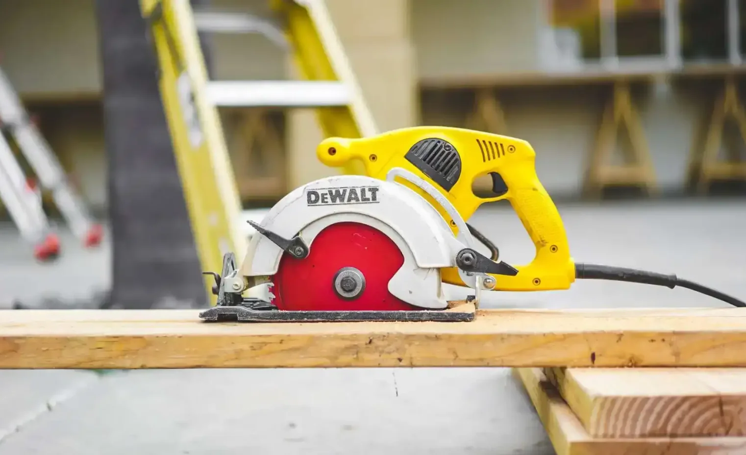 a dewalt wood chopper slicing wood in a work shop.webp